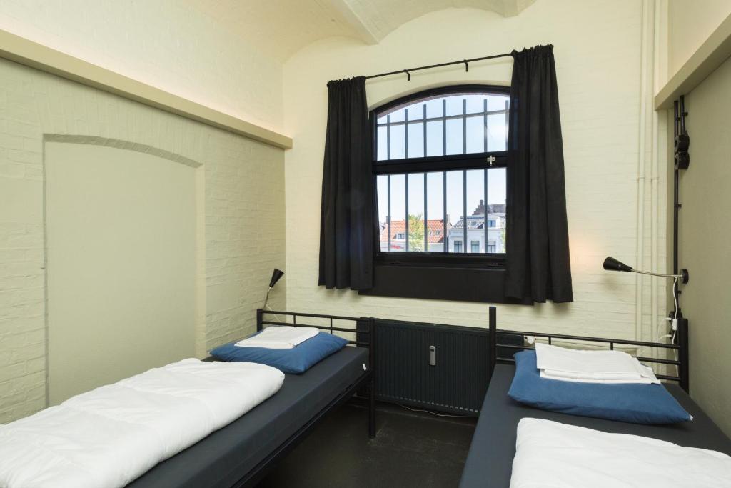 Postel nebo postele na pokoji v ubytování Alibi Hostel Leeuwarden
