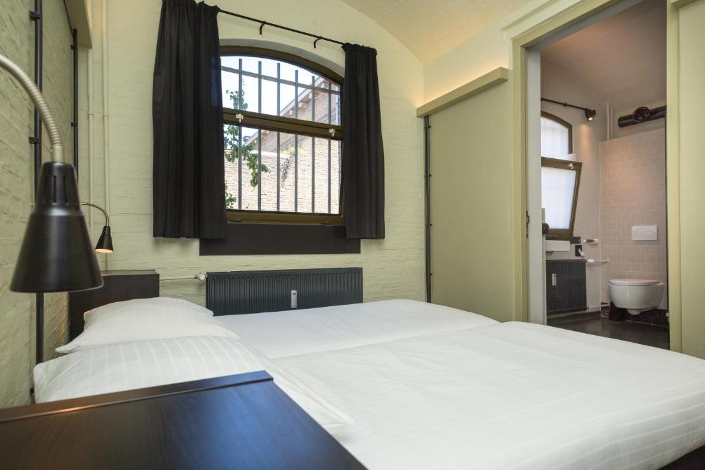 Postel nebo postele na pokoji v ubytování Alibi Hostel Leeuwarden