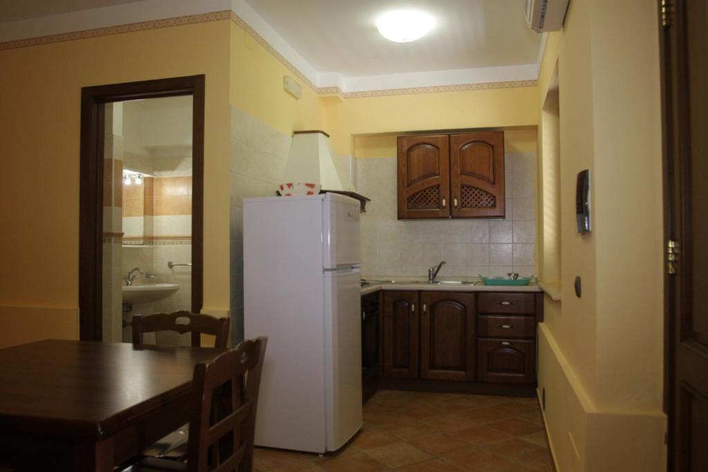 Кухня или мини-кухня в Residence Baia Infreschi
