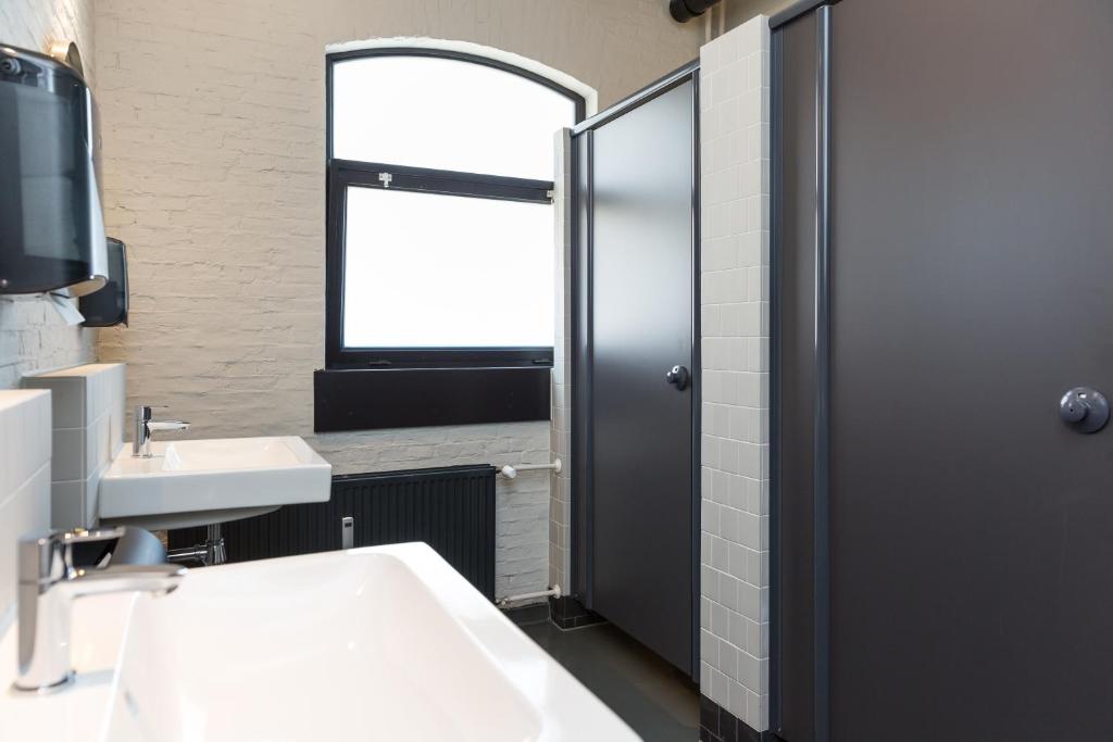 Postel nebo postele na pokoji v ubytování Alibi Hostel Leeuwarden