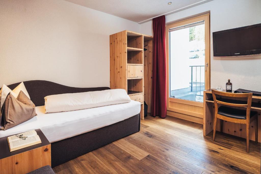 Postel nebo postele na pokoji v ubytování Hotel Cores