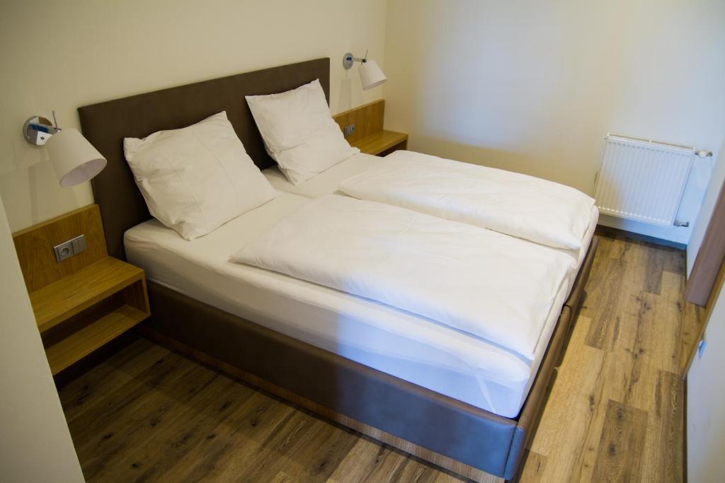 Postel nebo postele na pokoji v ubytování APART U LVA