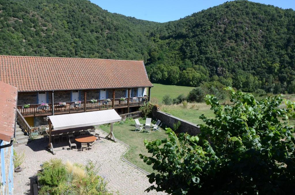 an aerial view of a house with mountains in the background at MARGARIDOU in Blesle