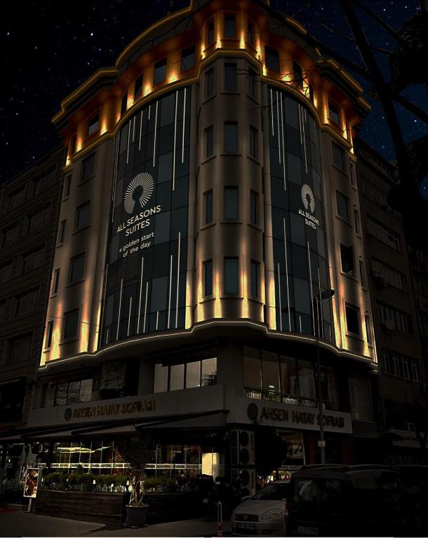 a large building with lights on it at night at All Seasons Suites in Istanbul