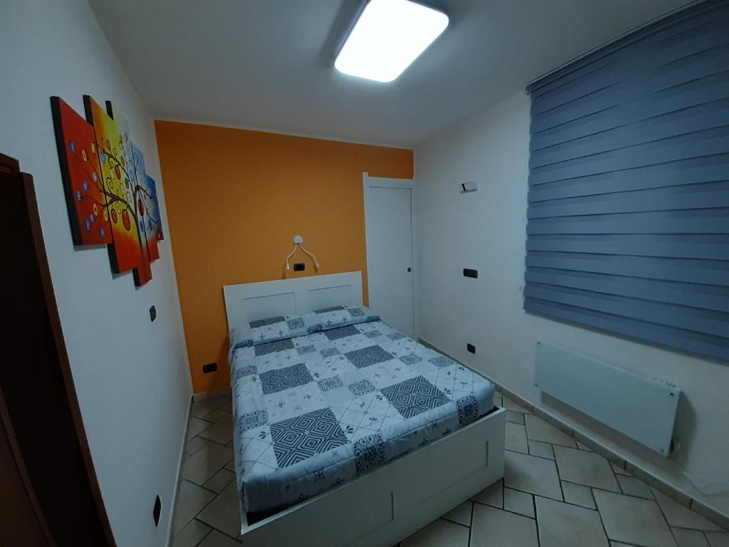 En eller flere senge i et værelse på Casa LuLù