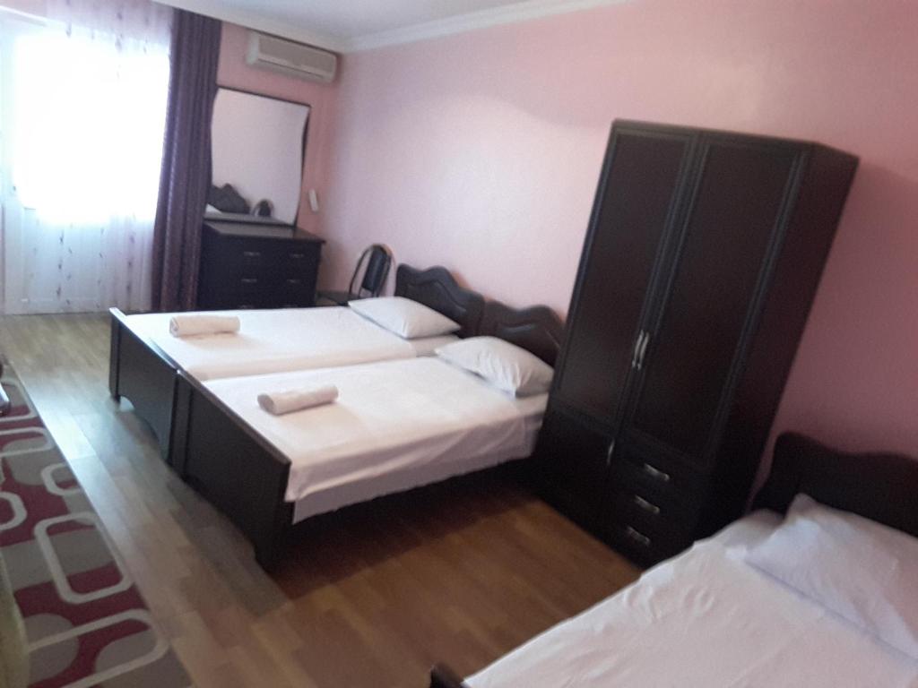 Postel nebo postele na pokoji v ubytování Hotel Lika