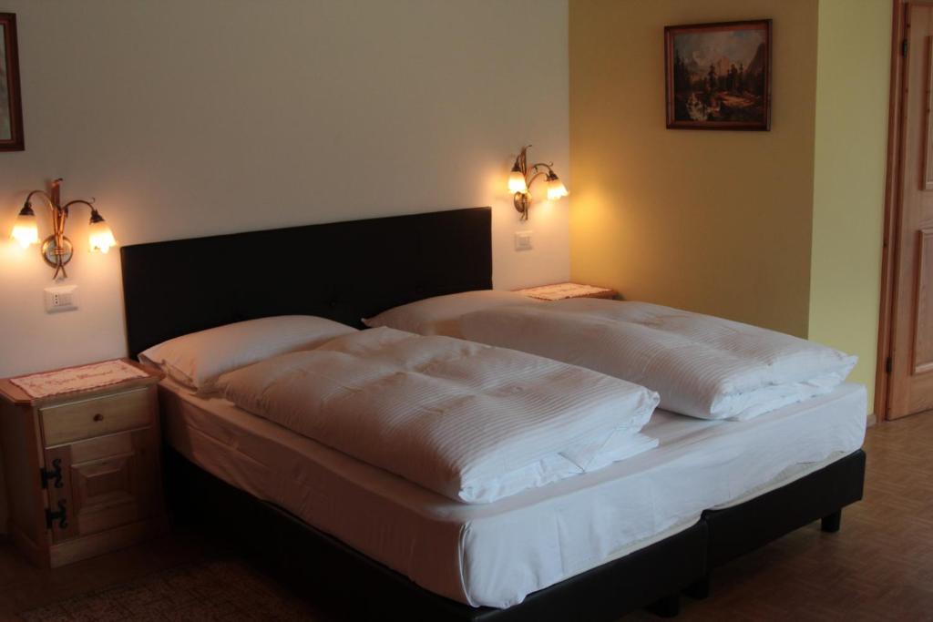 Postel nebo postele na pokoji v ubytování B&B Hotel Heidi
