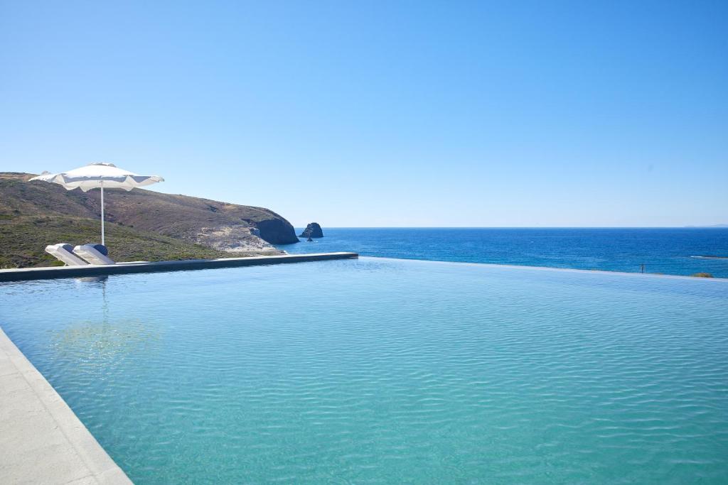 a large body of water with a blue sky at Milos Breeze Boutique Hotel in Pollonia