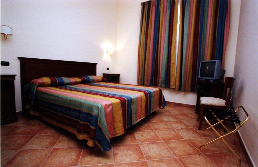 Cama o camas de una habitación en B&B Villa Rosa