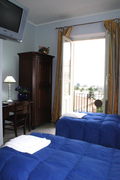 Posteľ alebo postele v izbe v ubytovaní Hotel Piro