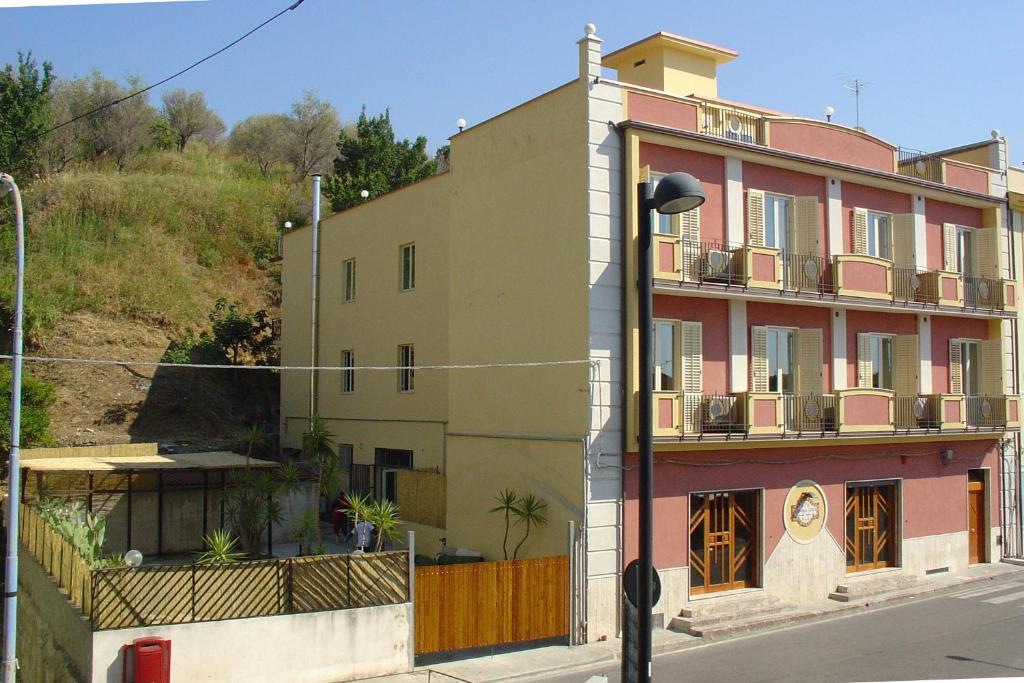 a building on the side of a street at Hotel Piro in Torrenova