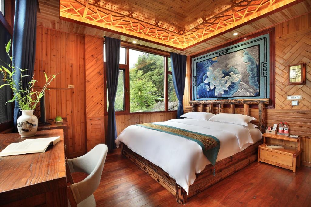 Postel nebo postele na pokoji v ubytování Baike Boutique Hotel