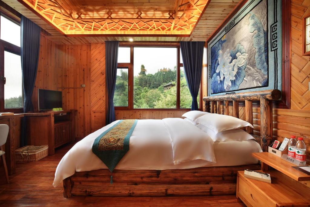 Postel nebo postele na pokoji v ubytování Baike Boutique Hotel