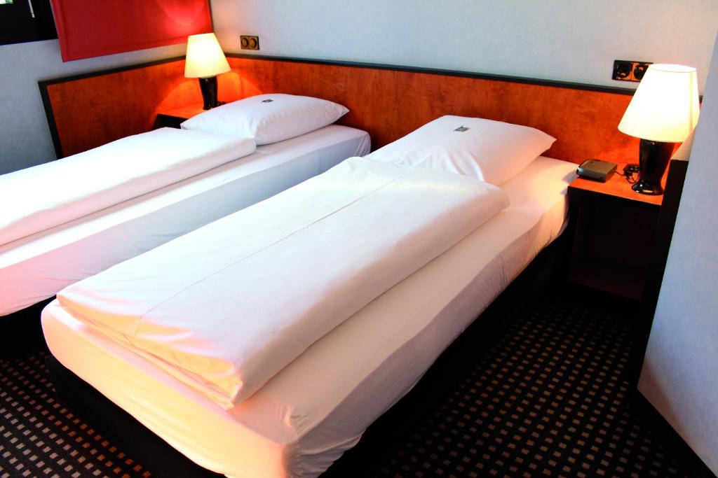 Postel nebo postele na pokoji v ubytování Ara Hotel Comfort