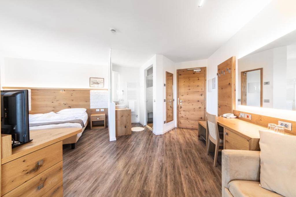 Postel nebo postele na pokoji v ubytování Hotel Montana