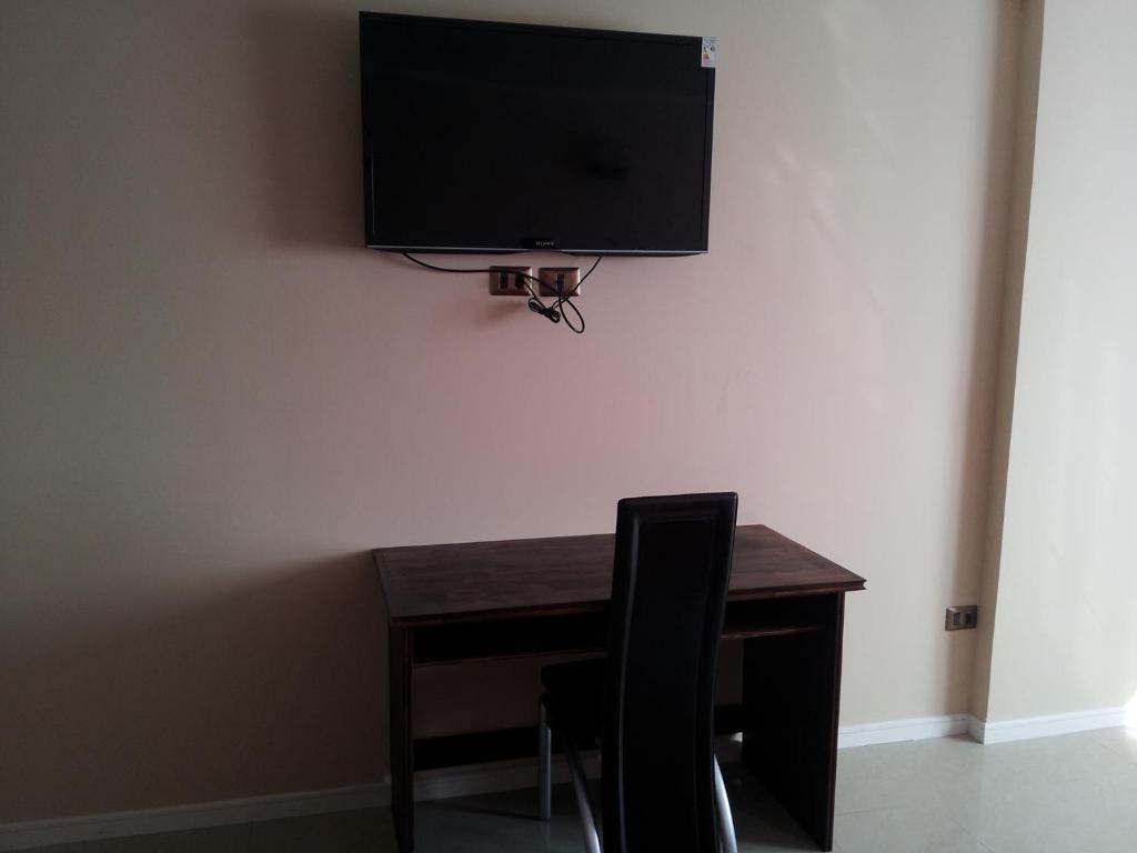 TV a/nebo společenská místnost v ubytování Hotel Astore Suites