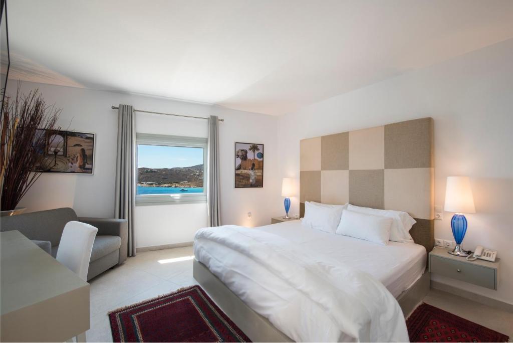 Postel nebo postele na pokoji v ubytování Greco Philia Hotel Boutique