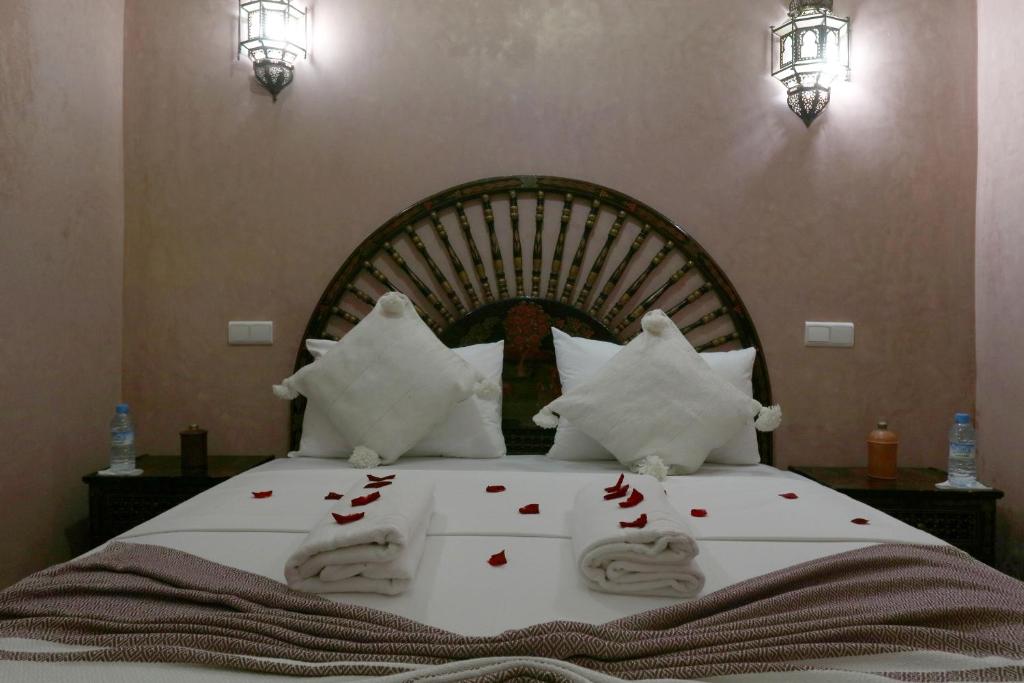 Uma cama ou camas num quarto em Riad Elite