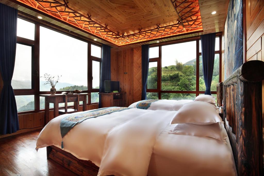 Postel nebo postele na pokoji v ubytování Baike Boutique Hotel