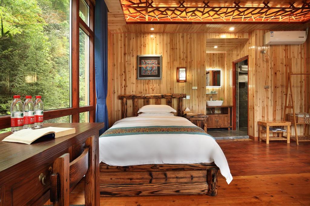 Postel nebo postele na pokoji v ubytování Baike Boutique Hotel