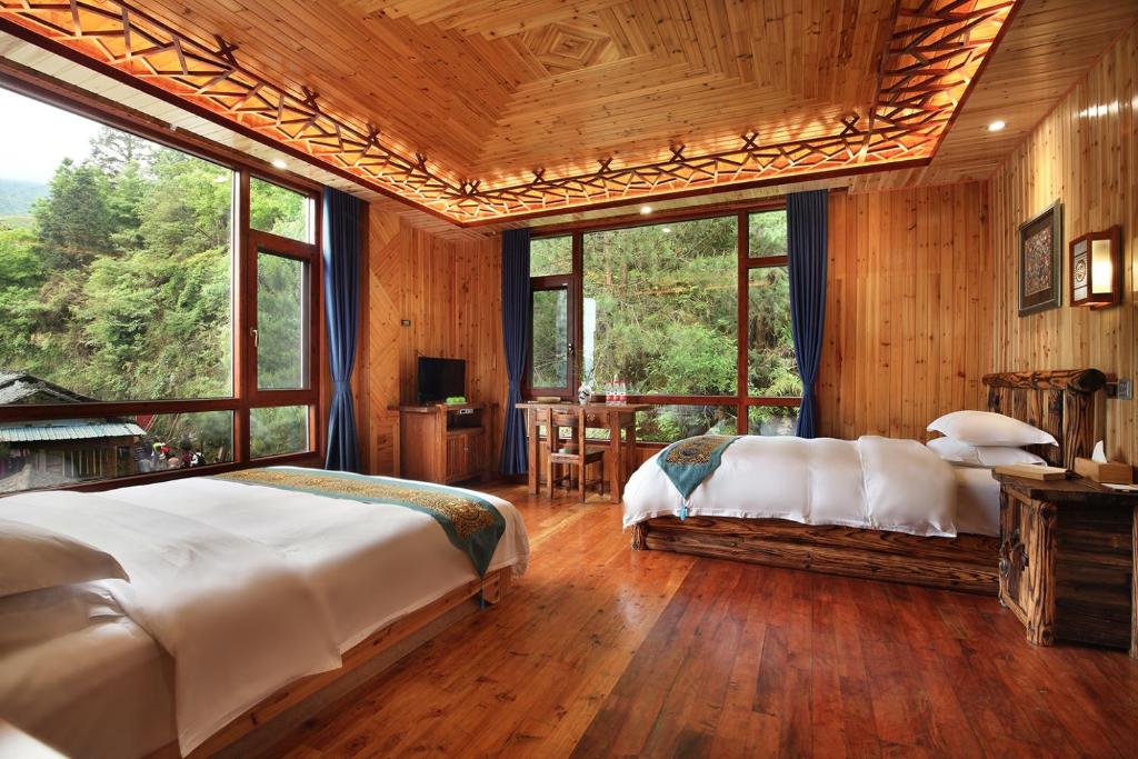 Postel nebo postele na pokoji v ubytování Baike Boutique Hotel