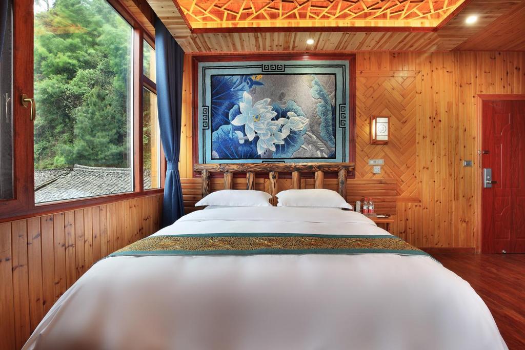 Postel nebo postele na pokoji v ubytování Baike Boutique Hotel