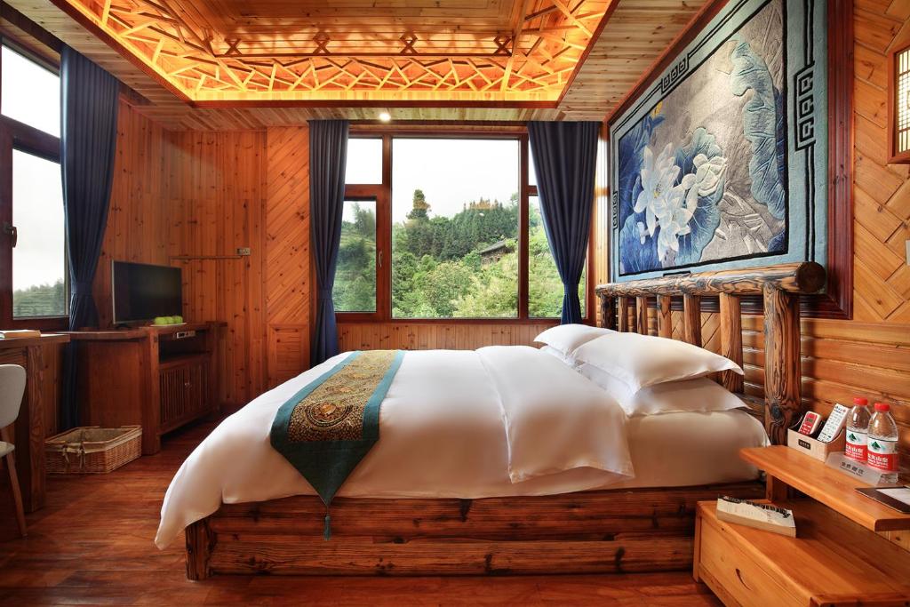 Postel nebo postele na pokoji v ubytování Baike Boutique Hotel