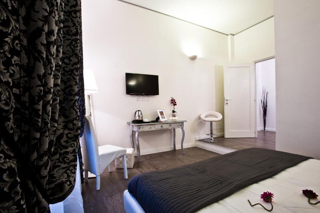 Televízia a/alebo spoločenská miestnosť v ubytovaní Rome Key Home