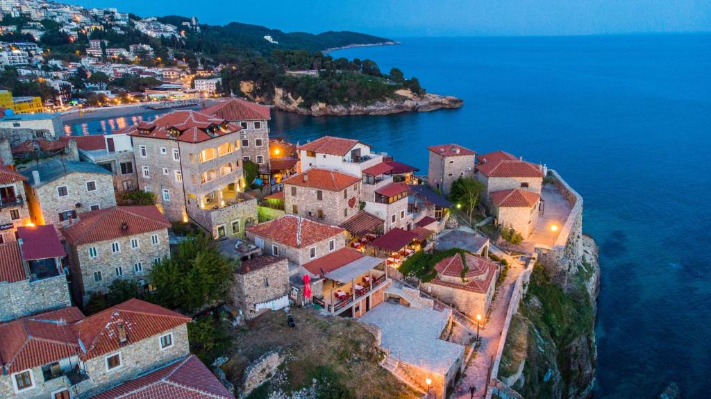 an aerial view of a town on the edge of the water at Villa Dulcinea in Ulcinj
