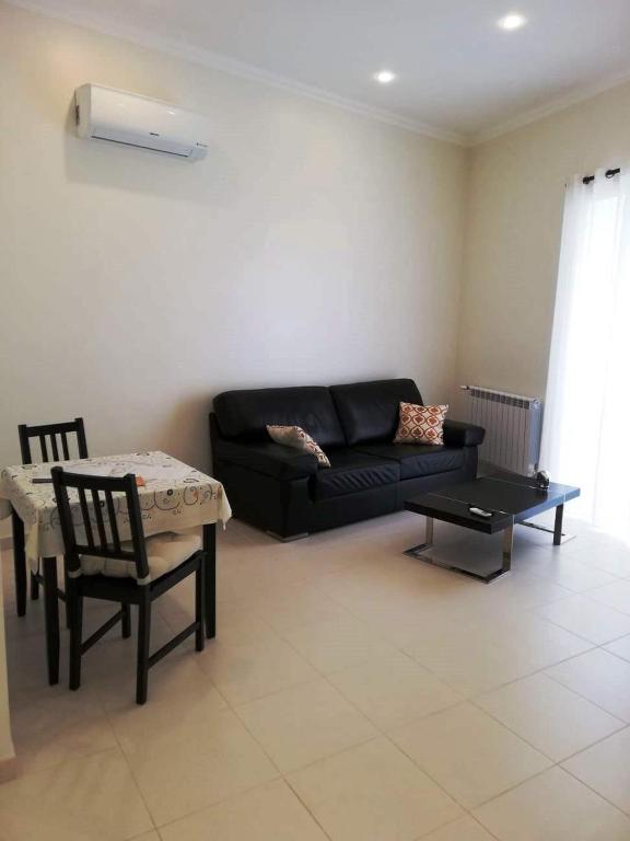 Posezení v ubytování Cândido Reis Apartments