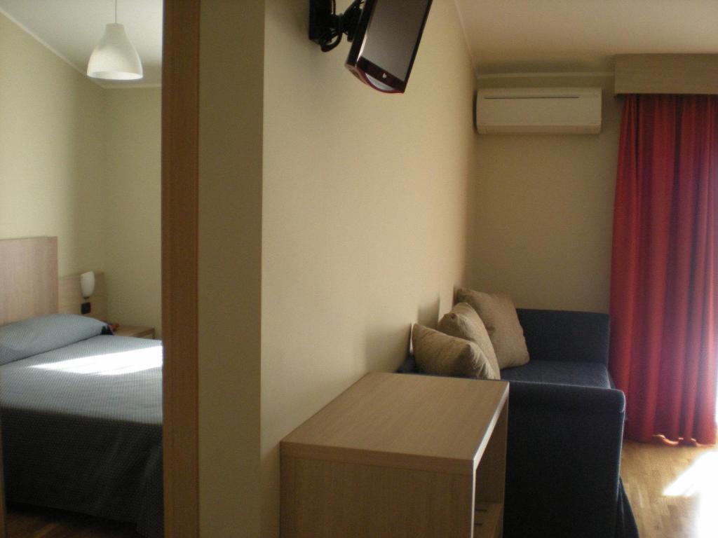 Postel nebo postele na pokoji v ubytování Heraclea Hotel Residence