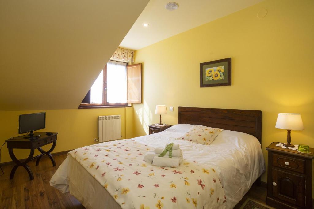 Cama o camas de una habitación en Hotel Rural As Laguas