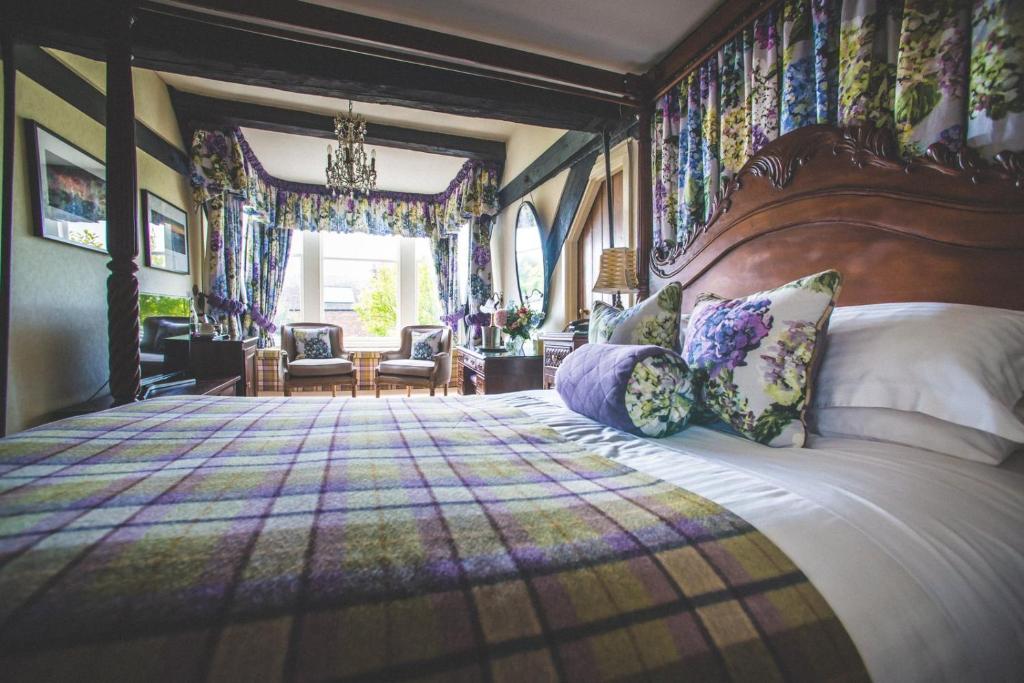 a bedroom with a large bed with pillows at Jeakes House in Rye