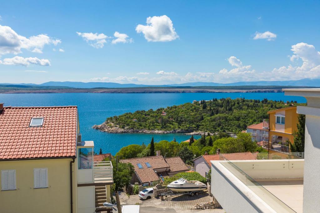 a view of a body of water from a building at Apartmani Mirta in Dramalj