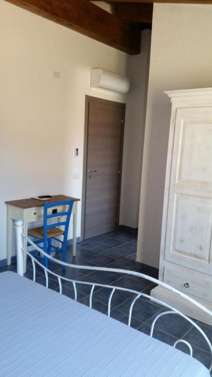 Postel nebo postele na pokoji v ubytování S'Apposentu Teuladesu Affittacamere del Ristorante da Stefano