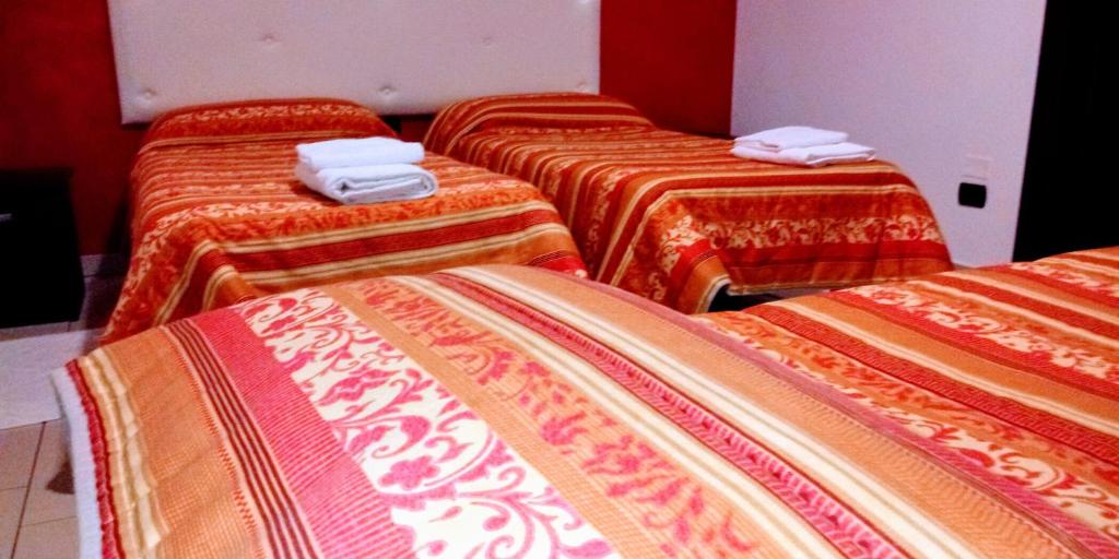 Postel nebo postele na pokoji v ubytování Hotel 660
