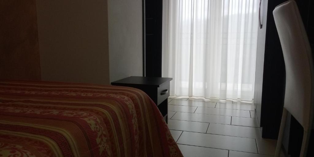 Postel nebo postele na pokoji v ubytování Hotel 660