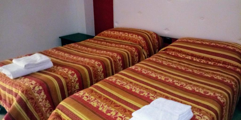 Postel nebo postele na pokoji v ubytování Hotel 660