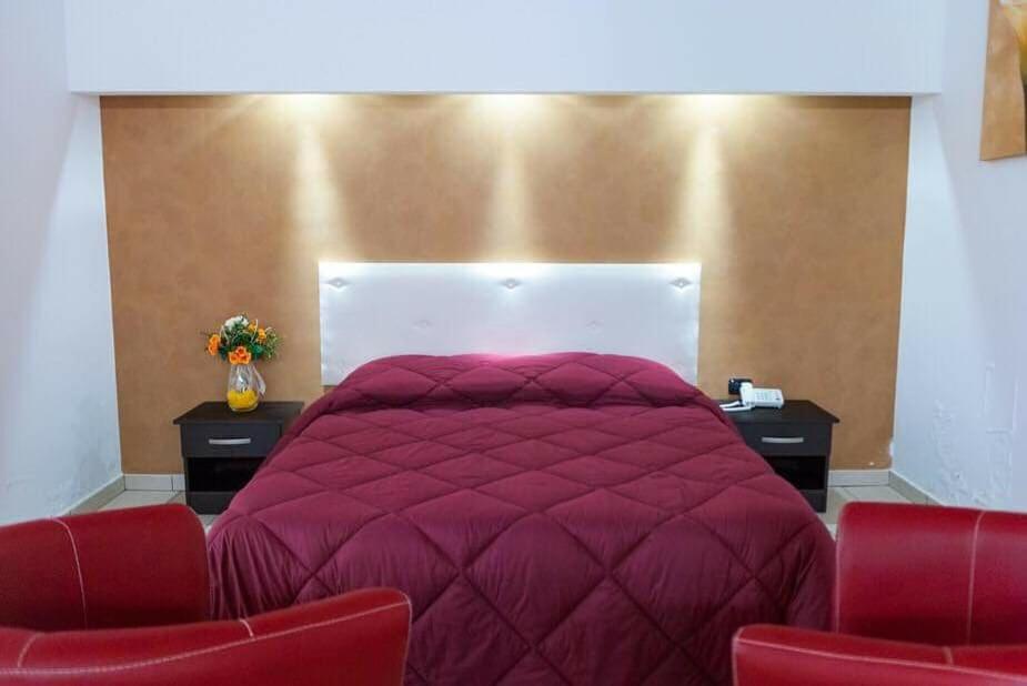 Postel nebo postele na pokoji v ubytování Hotel 660