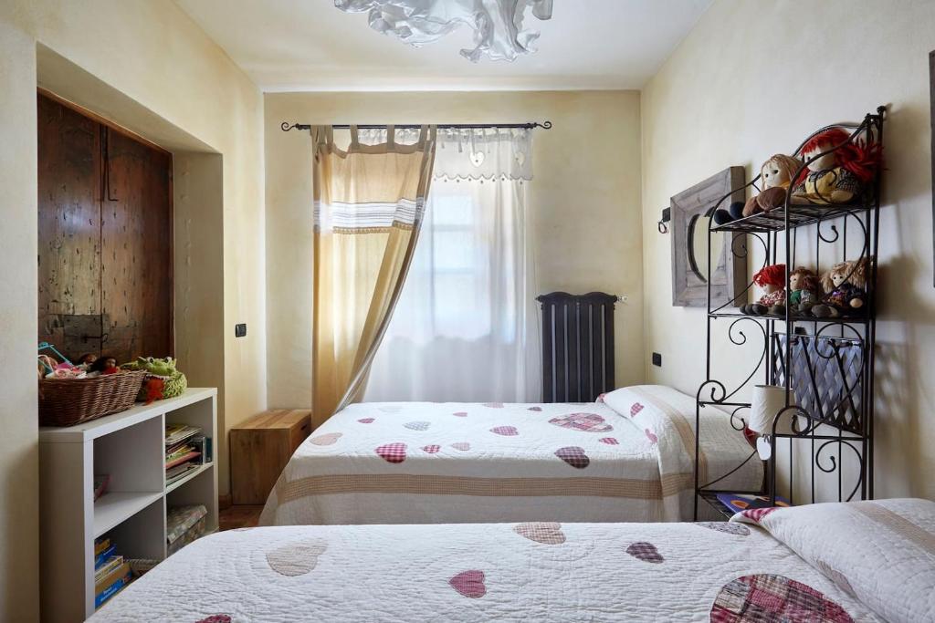 Postel nebo postele na pokoji v ubytování Il vecchio fienile