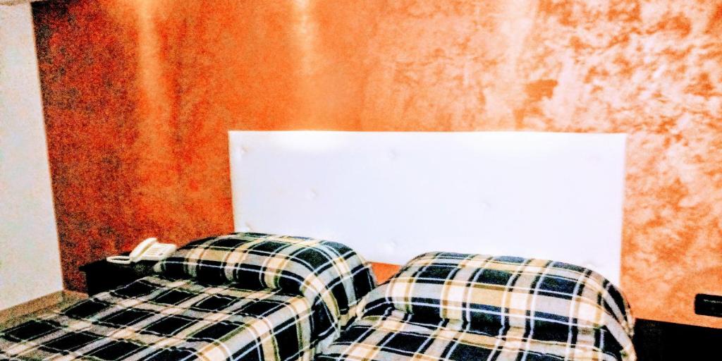 Postel nebo postele na pokoji v ubytování Hotel 660