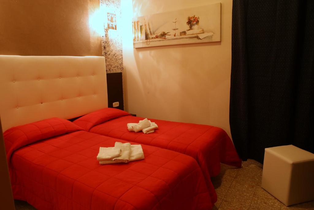 Postel nebo postele na pokoji v ubytování Hotel Busignani