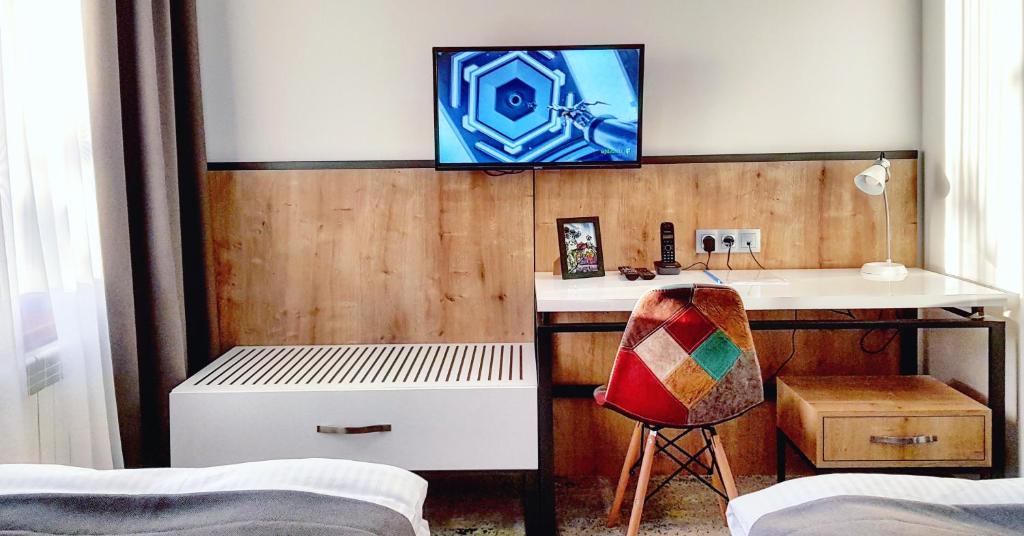 TV a/nebo společenská místnost v ubytování Hotel Alpha