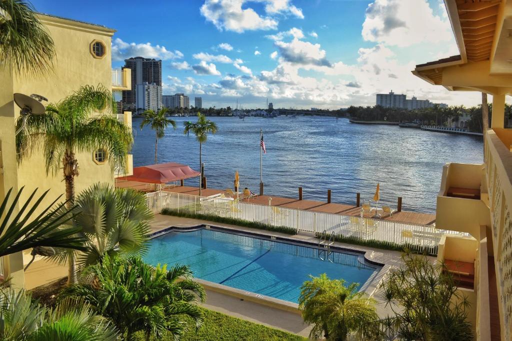 a view of a river from a building with a swimming pool at Fort Lauderdale Yacht and Beach Club 416 in Fort Lauderdale