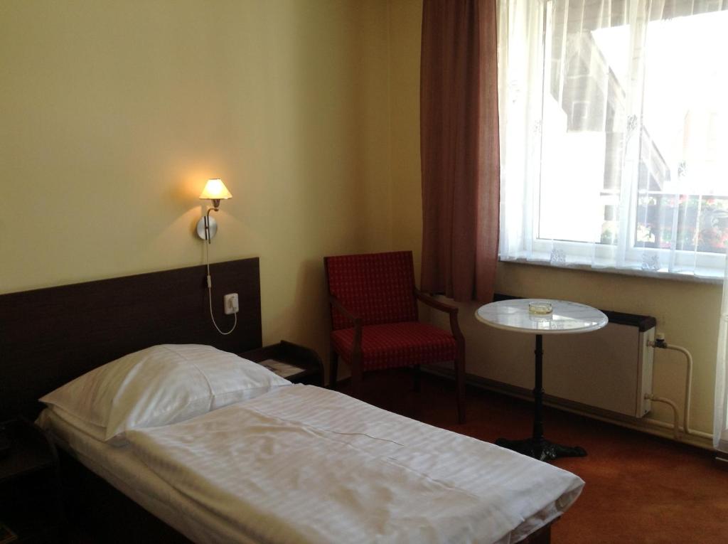 Postel nebo postele na pokoji v ubytování Hotel YORK