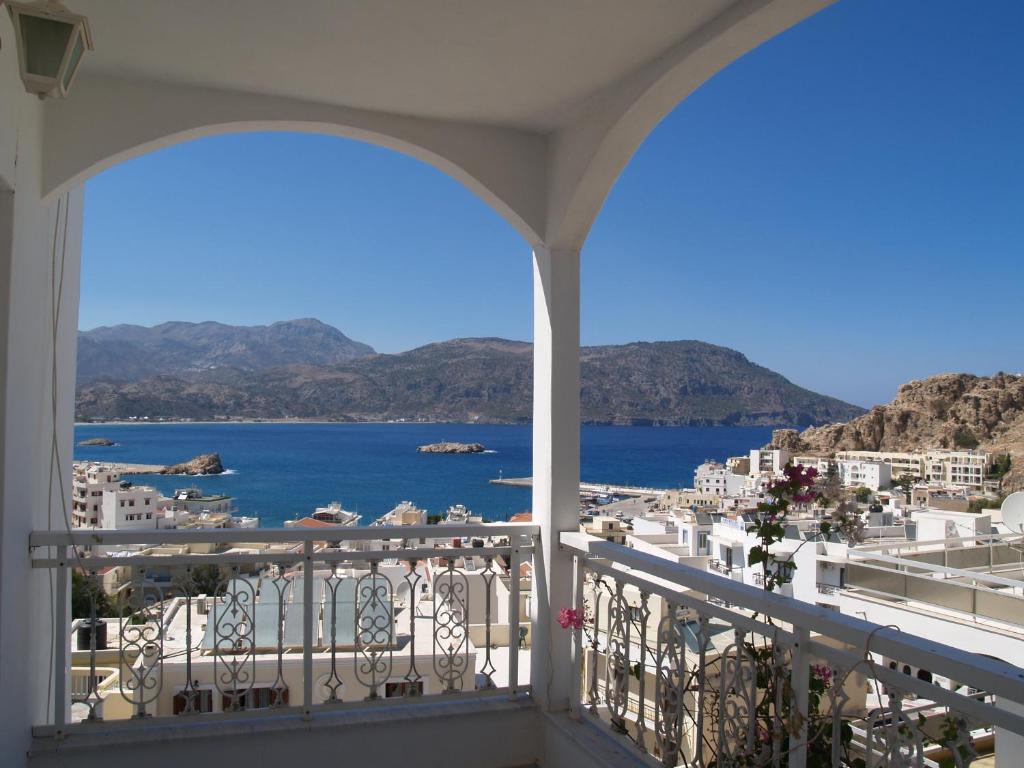 a balcony with a view of the ocean at Roses Studios in Karpathos