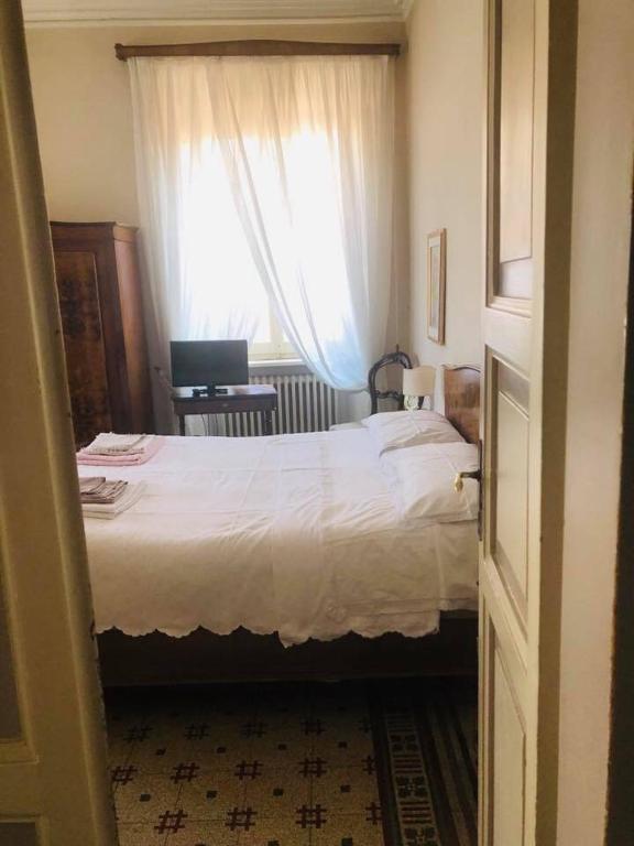 Posteľ alebo postele v izbe v ubytovaní Attico Luce B&B