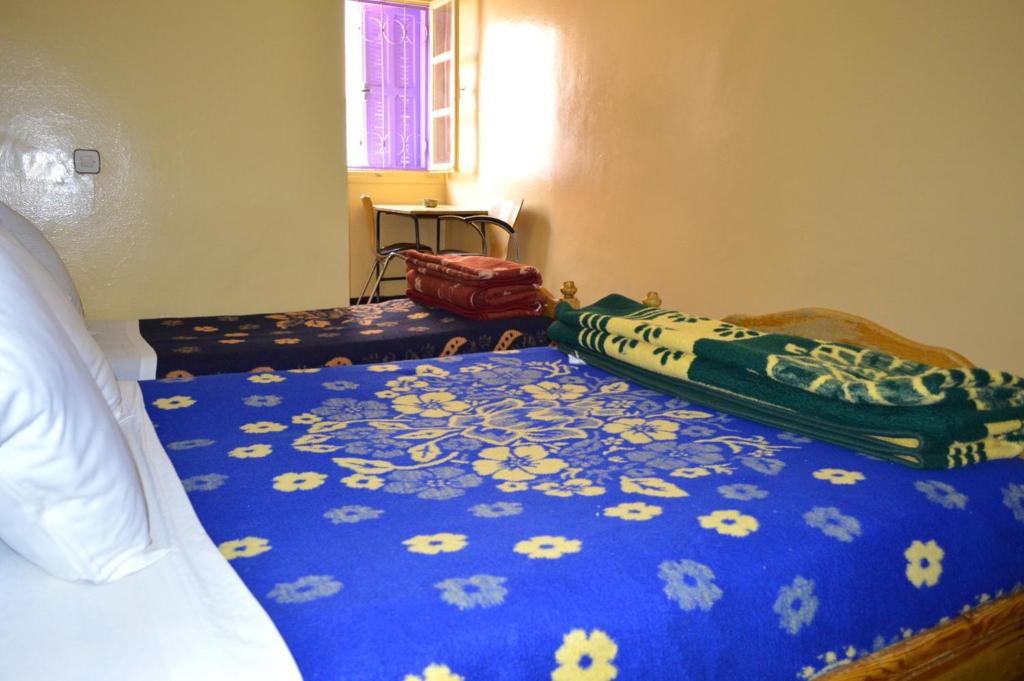 Postel nebo postele na pokoji v ubytování Hotel Atlas Ouarzazate