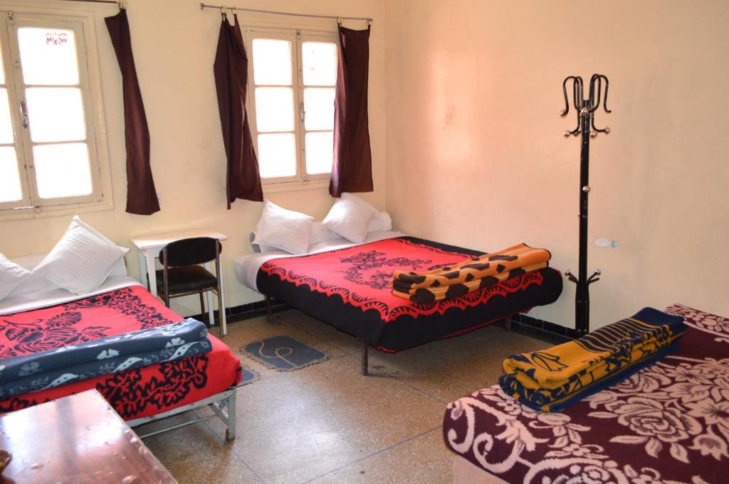 Postel nebo postele na pokoji v ubytování Hotel Atlas Ouarzazate