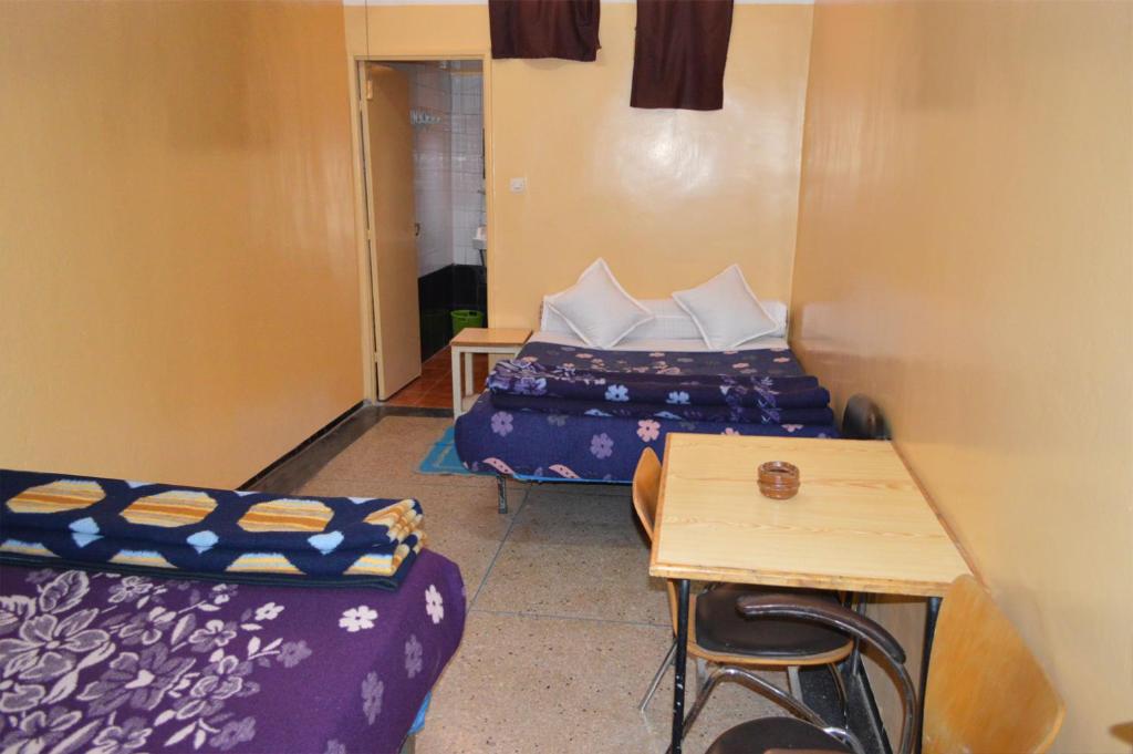 Postel nebo postele na pokoji v ubytování Hotel Atlas Ouarzazate